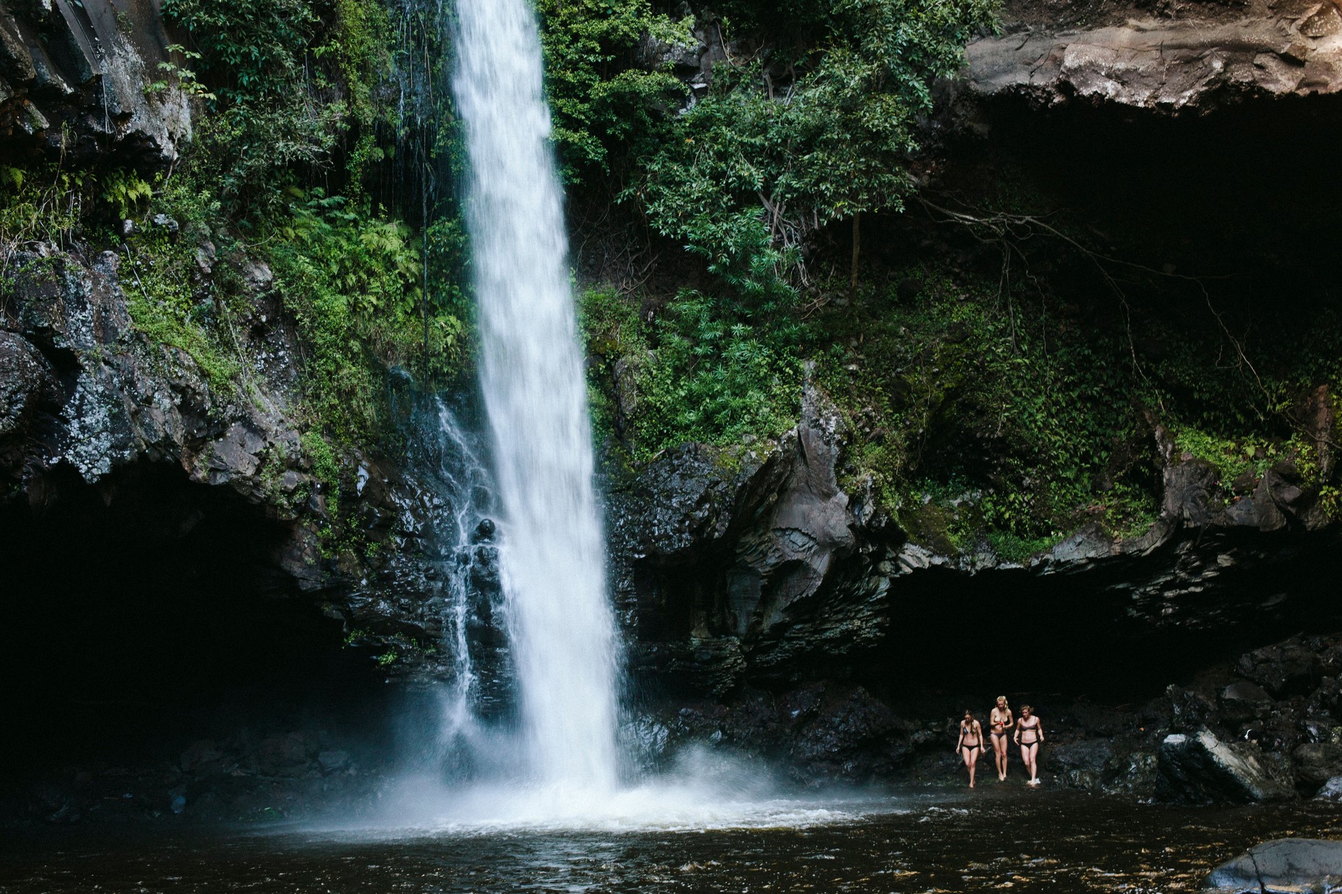 Three Women by a Waterfall in Hawaii